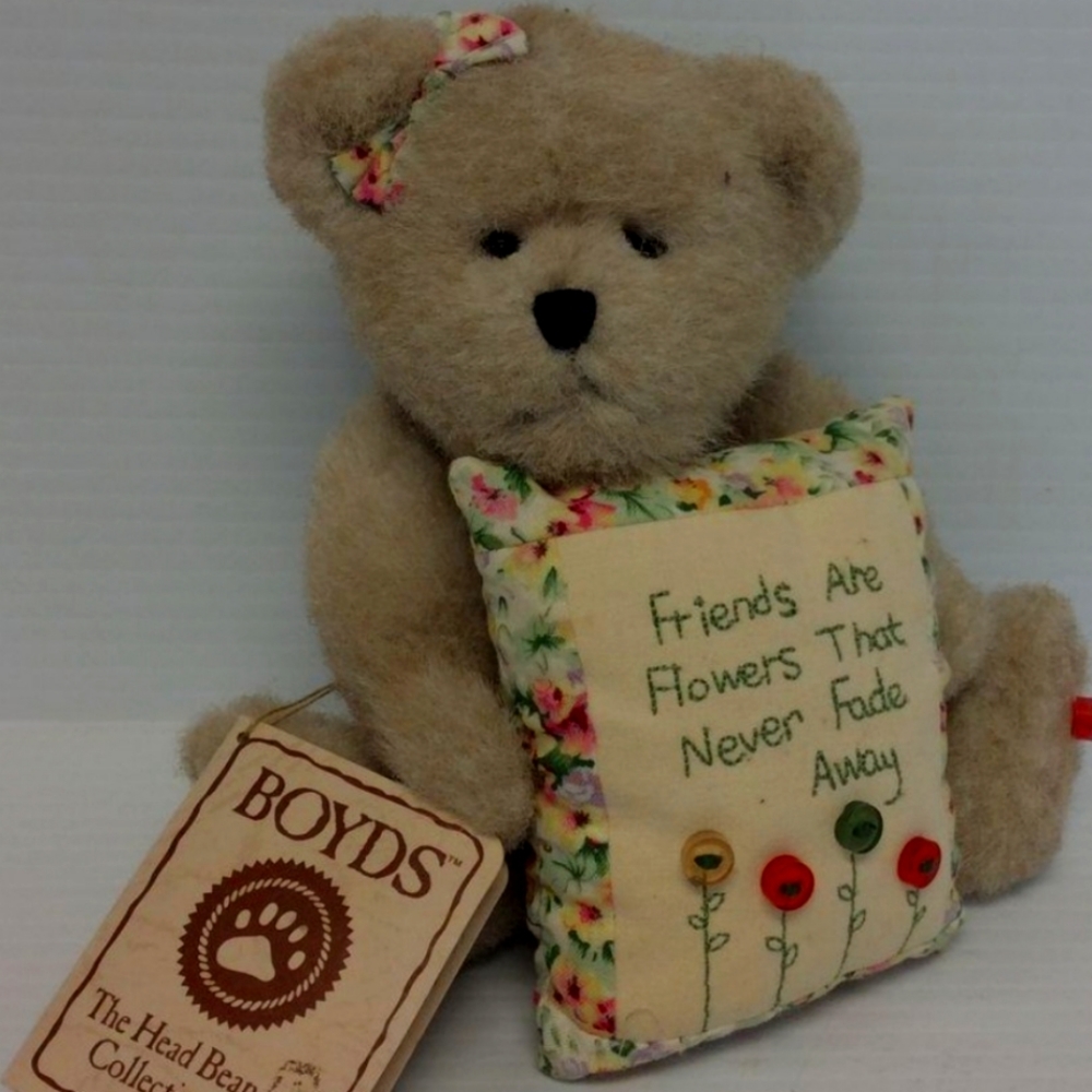 This vintage plush bear from Boyd's Bears is a must-have for any collector.
